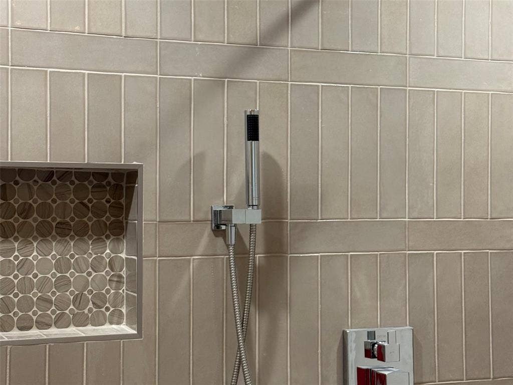 9620 Lakemont Drive, Dallas, TX 75220 Recessed shower niche with mosaic tile, chrome handheld shower, and integrated shower controls