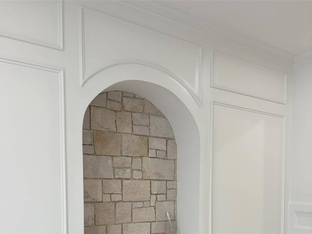 9620 Lakemont Drive, Dallas, TX 75220 Archway with stone-finish interior and detailed wall paneling