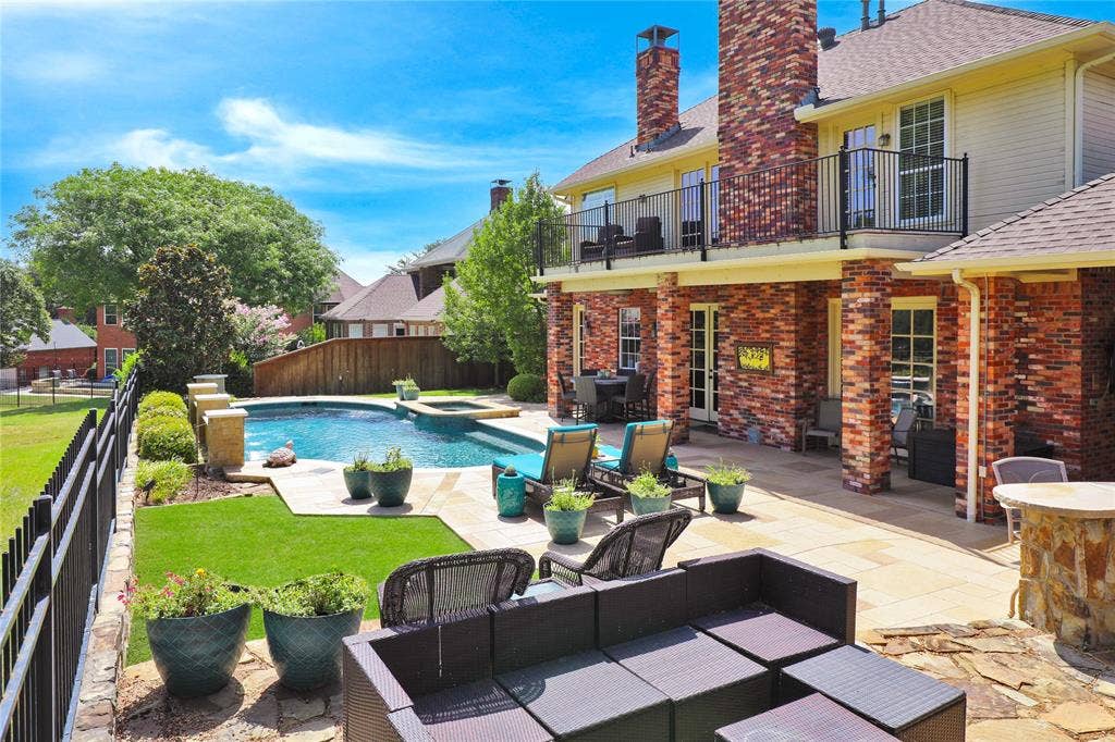 1204 Hills Creek Drive, McKinney, TX 75072 Expansive backyard featuring a swimming pool, integrated spa, and spacious patio