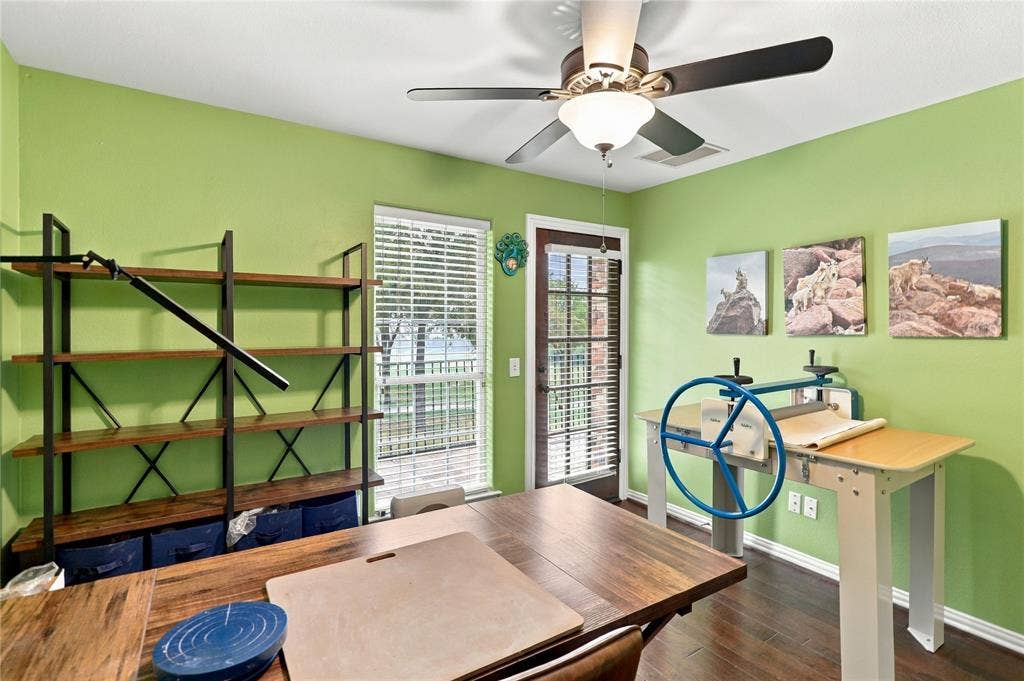1204 Hills Creek Drive, McKinney, TX 75072 Hardwood-finish flooring, ceiling fan, and a glass-paneled exterior door with blinds