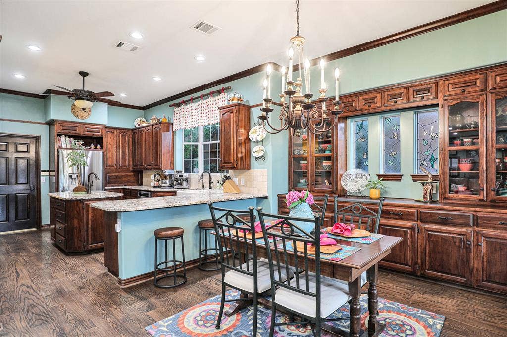 1204 Hills Creek Drive, McKinney, TX 75072 Wood-finish flooring, recessed lighting, and a decorative ceiling fan
