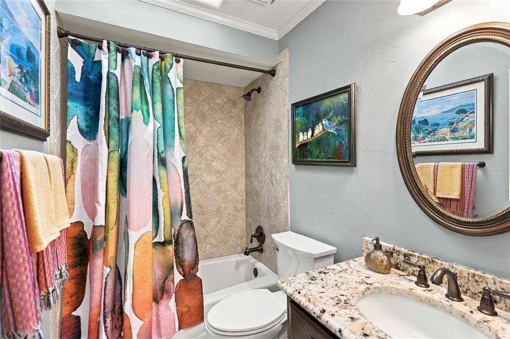 1204 Hills Creek Drive, McKinney, TX 75072 Bathroom featuring a vanity with a granite countertop, undermount sink, and bronze-finish faucet