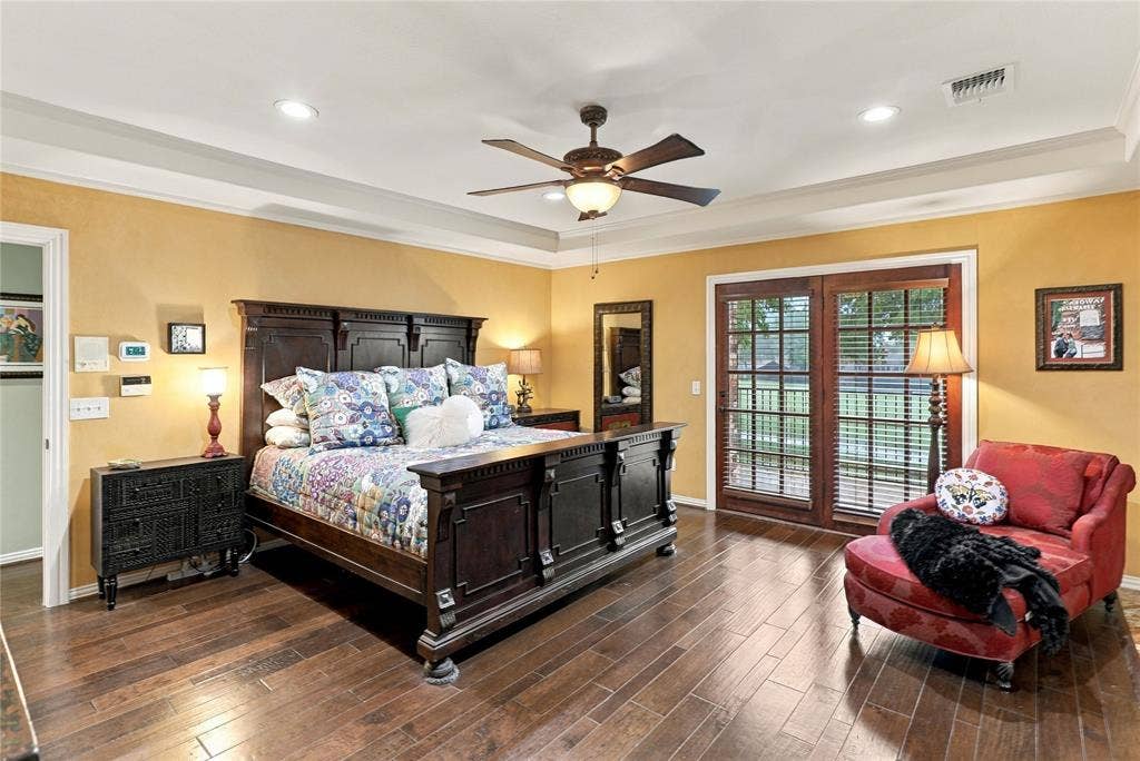 1204 Hills Creek Drive, McKinney, TX 75072 Tray ceiling with recessed lighting, wood-finish flooring, and French doors