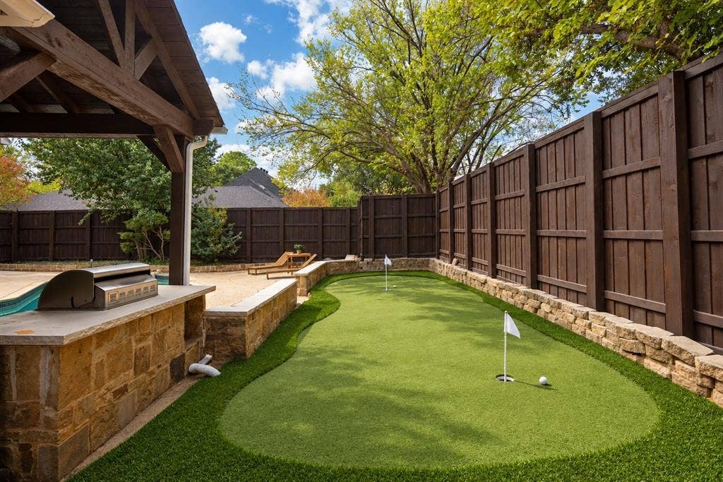 How about a putting green?  (This photo has been digitally edited to show how a bocce ball court would transform this space.) The possibilities are endless!
