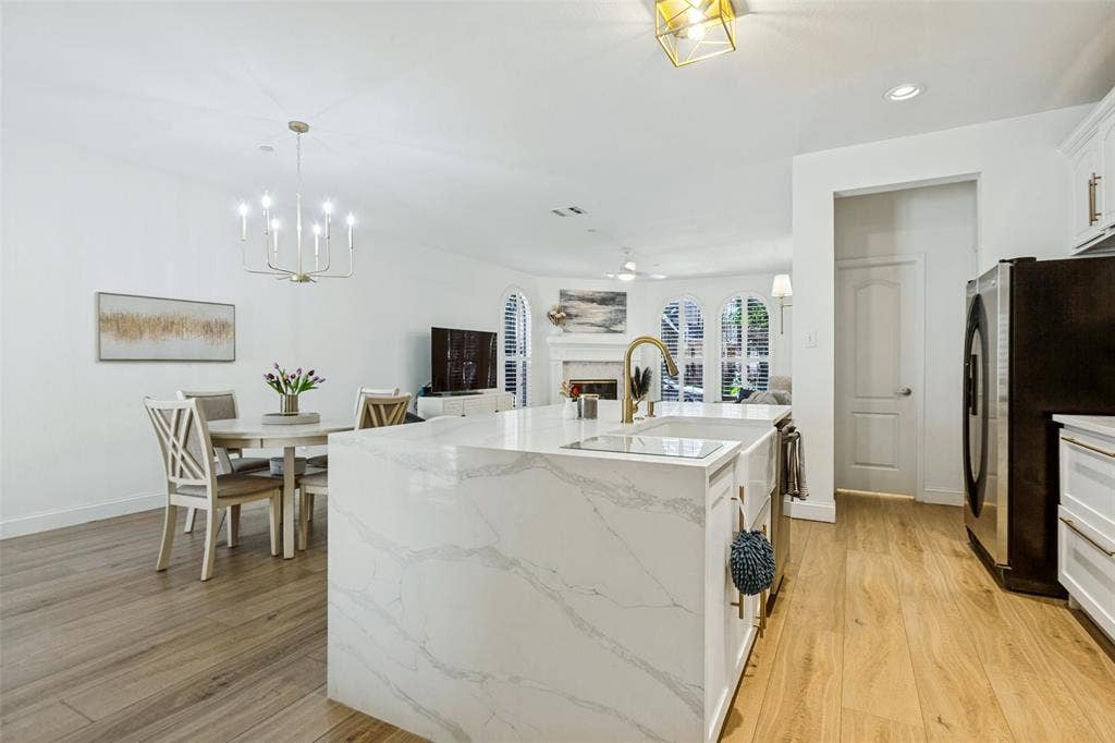 6816 Livorno Lane, Frisco, TX 75034 Quartz waterfall island with farm sink and gooseneck faucet