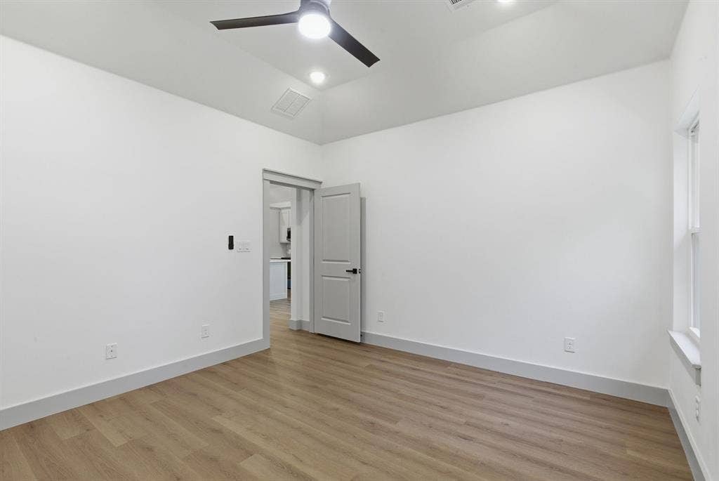 14583 Cherokee Lane, Log Cabin, TX 75148 Wood-finish flooring, recessed lighting, and a contemporary ceiling fan