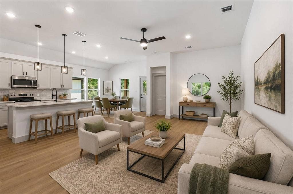 14583 Cherokee Lane, Log Cabin, TX 75148 Virtual image Open-concept living space featuring wood-finish flooring, recessed lighting, and a vaulted ceiling