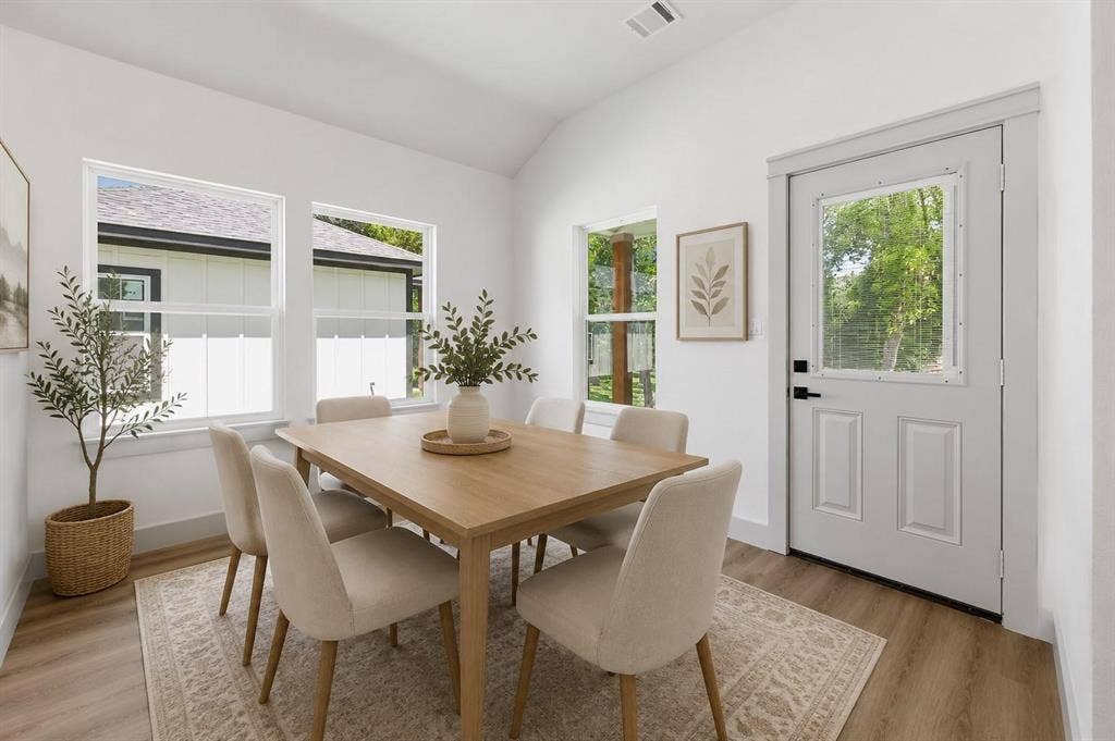14583 Cherokee Lane, Log Cabin, TX 75148 Virtual image Vaulted ceiling with recessed lighting, wood-finish flooring, multiple windows, and a paneled exterior door with an inset window