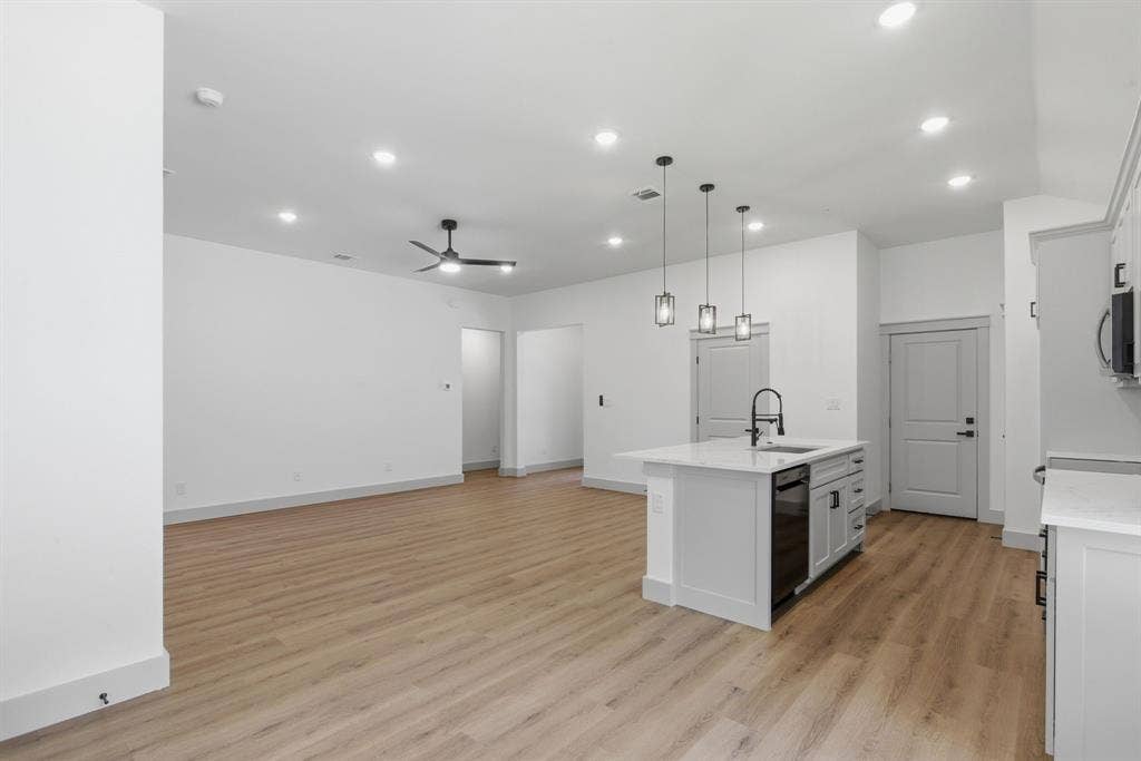 14583 Cherokee Lane, Log Cabin, TX 75148 Open-concept living space featuring wood-finish flooring, recessed lighting, and a ceiling fan