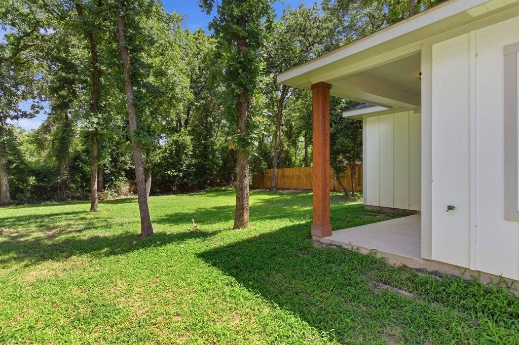 14583 Cherokee Lane, Log Cabin, TX 75148 Expansive rear yard featuring mature trees and a manicured lawn