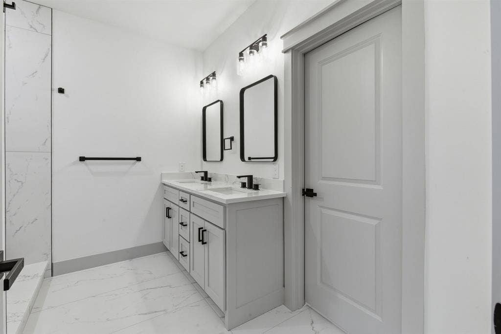 14583 Cherokee Lane, Log Cabin, TX 75148 Dual vanity with white undermount sinks and matte black fixtures