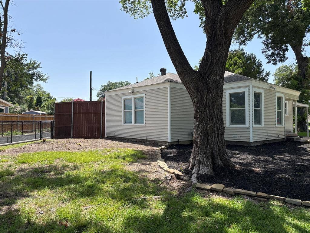 1502 Resistol Road, Garland, TX 75042 East side elevation. The fencing could be moved out to enlarge the private backyard area