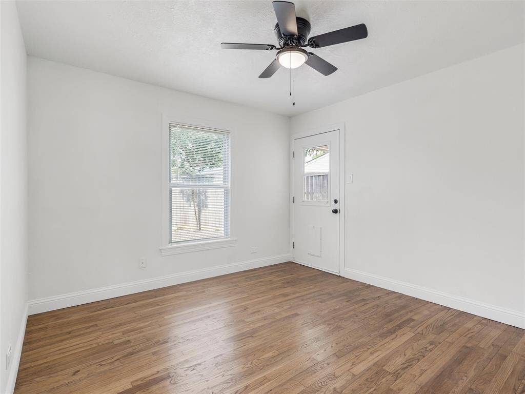 1502 Resistol Road, Garland, TX 75042 Bedroom #2 has an exit to the rear patio and also features a walkin closet