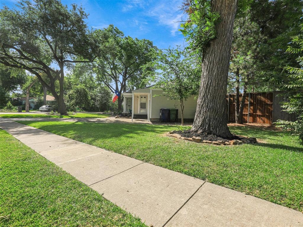 1502 Resistol Road, Garland, TX 75042 View from west showing expansive treed lot
