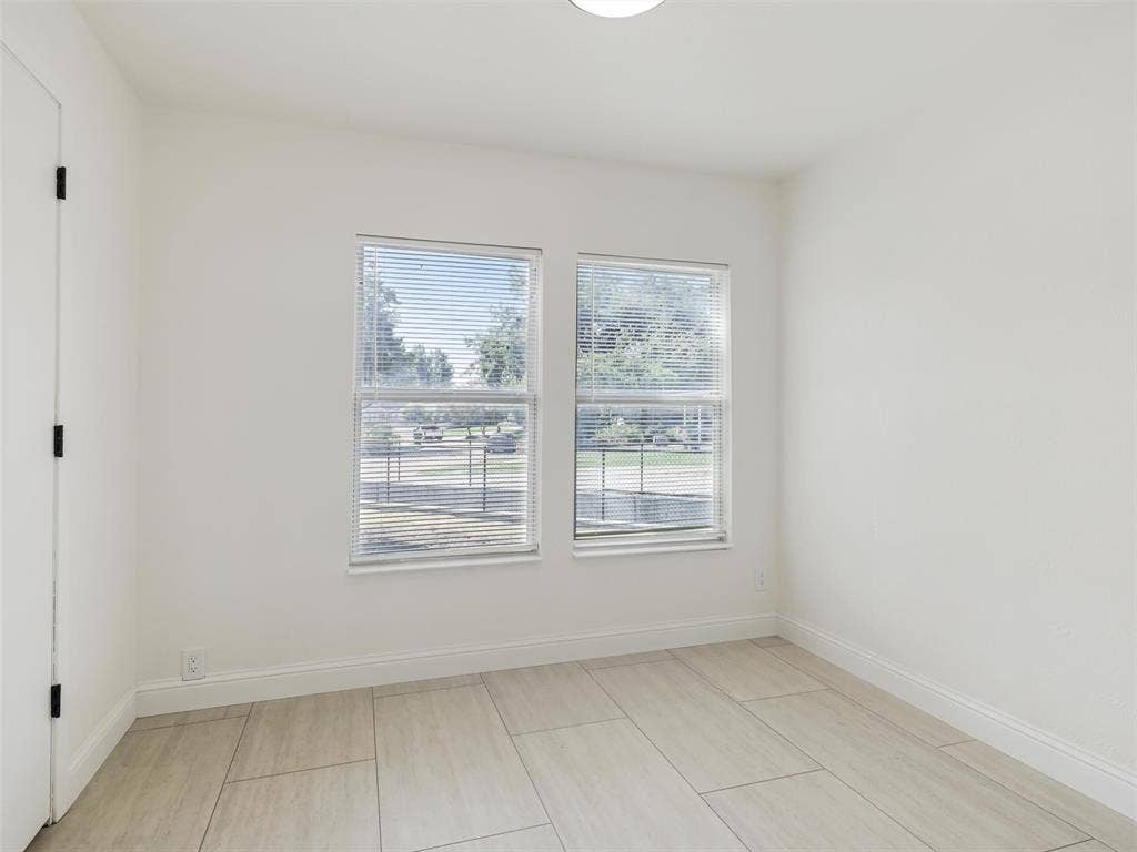 1502 Resistol Road, Garland, TX 75042 Bedroom #3 is perfect as a bedroom, nursery or office. Large walkin closet can be cusomized for variable needs. This bedroom is split from the others.