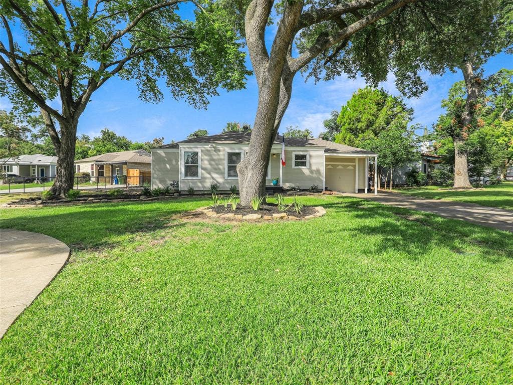 1502 Resistol Road, Garland, TX 75042 Beautiful lot and extra parking space in addition to the garage.