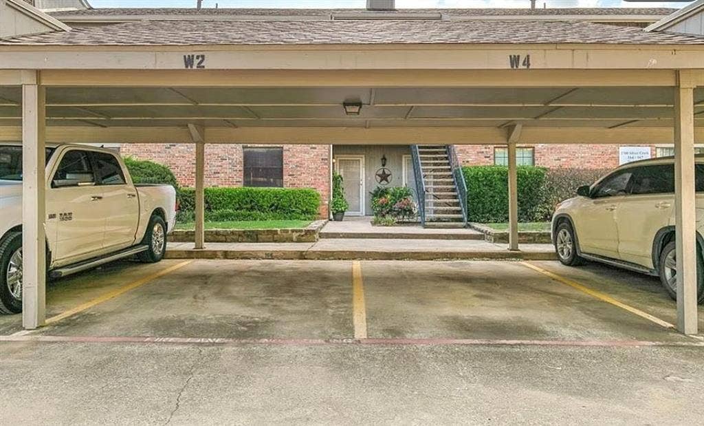 Covered parking structure with designated parking spaces