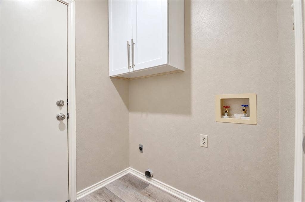 2040 Garden Crest Lane, Dallas, TX 75232 Laundry room with storage