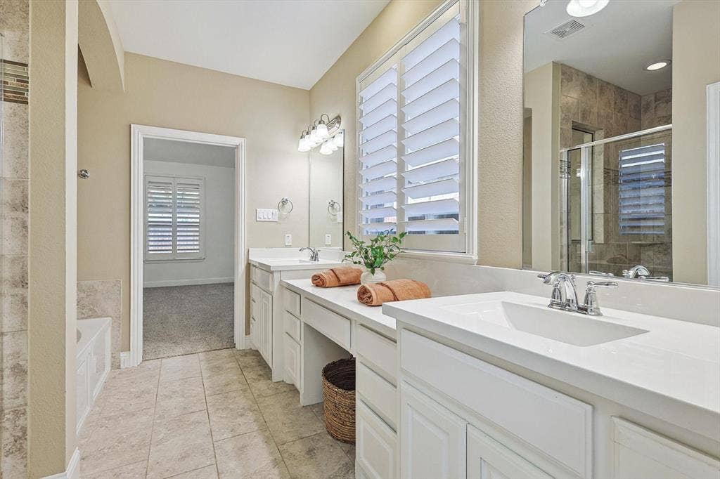 Dual vanity with integrated sinks and chrome fixtures