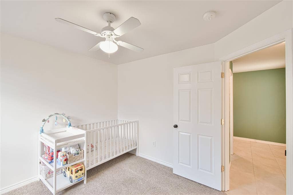 2108 8th Street, Brownwood, TX 76801 Recessed ceiling fan with integrated lighting, carpeted flooring, white trim, and a white six-panel door