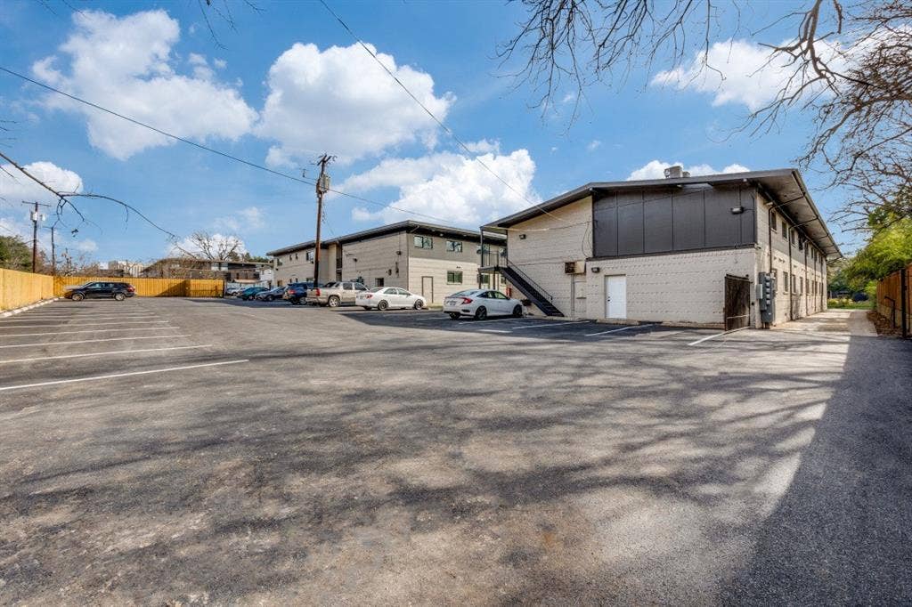 5917 Gaston Avenue, #115, Dallas, TX 75214 Expansive asphalt parking lot with painted parking lines