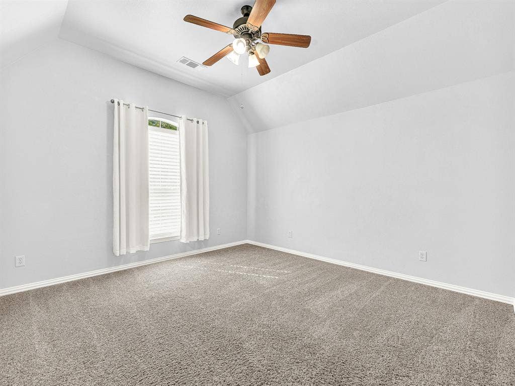 10222 Plainsman Lane, Frisco, TX 75035 Carpeted flooring, vaulted ceiling, window with blinds, ceiling fan with light fixture