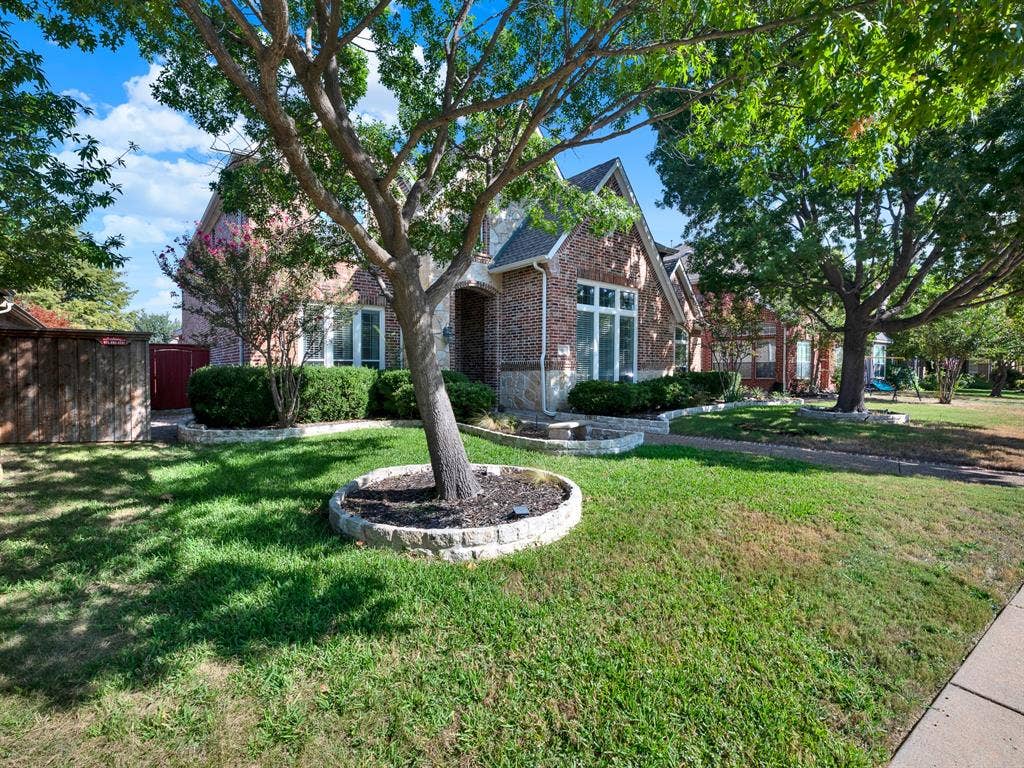 10222 Plainsman Lane, Frisco, TX 75035 Brick and stone exterior with gabled roof lines