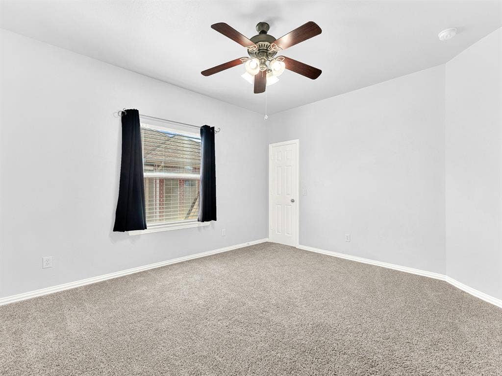 10222 Plainsman Lane, Frisco, TX 75035 Carpeted room featuring a ceiling fan with integrated lighting, a paneled door, and a window with horizontal blinds