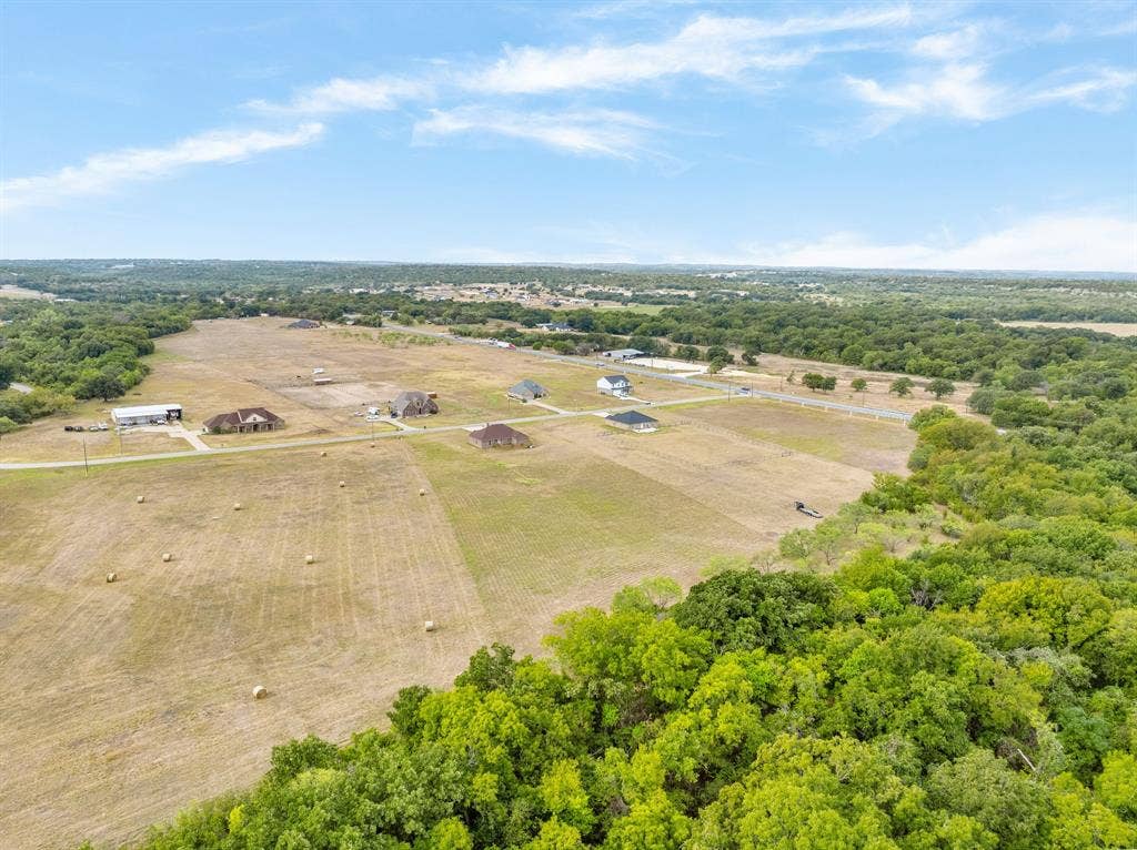 1215 River Hills Road, Stephenville, TX 76401 Drone view of surrounding land and trees