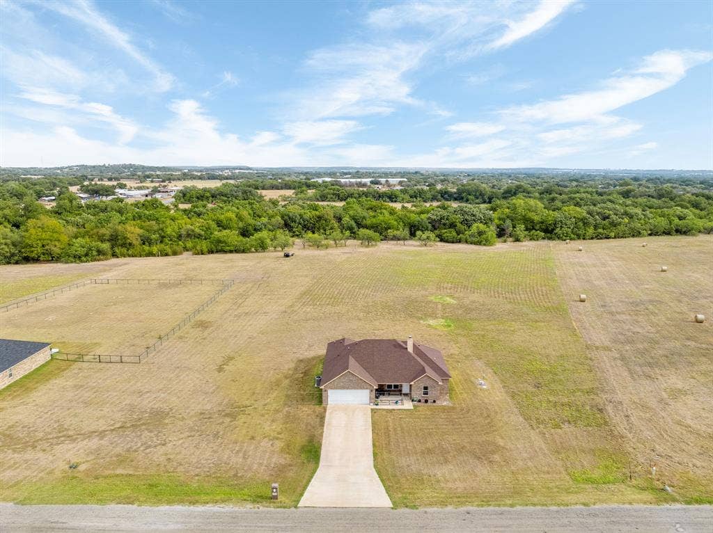 1215 River Hills Road, Stephenville, TX 76401 Drone view of the long driveway and acreage