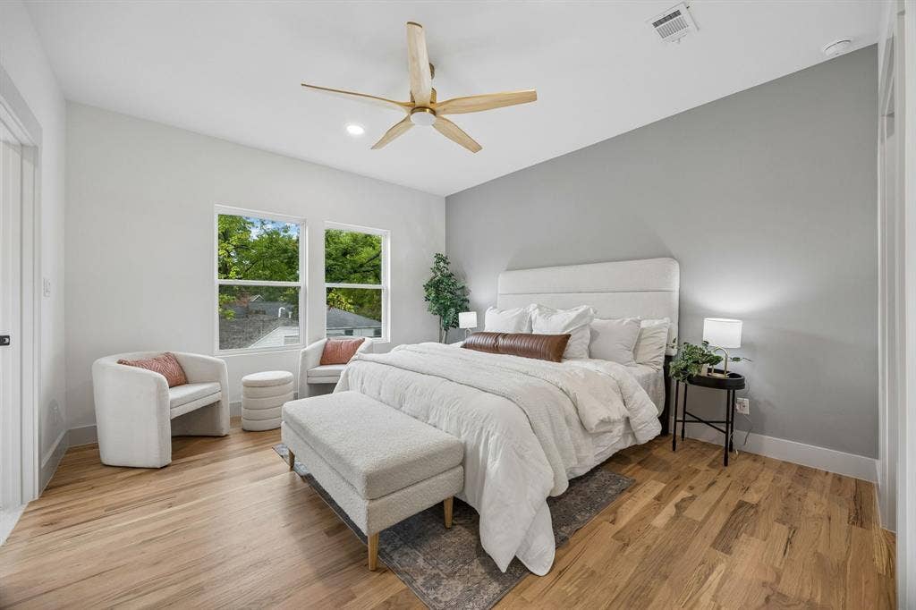 Primary bedroom featuring a ceiling fan and recessed lighting.