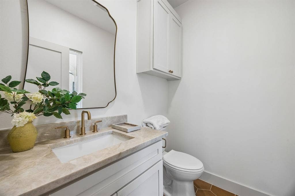 Half bathroom with light-colored countertop