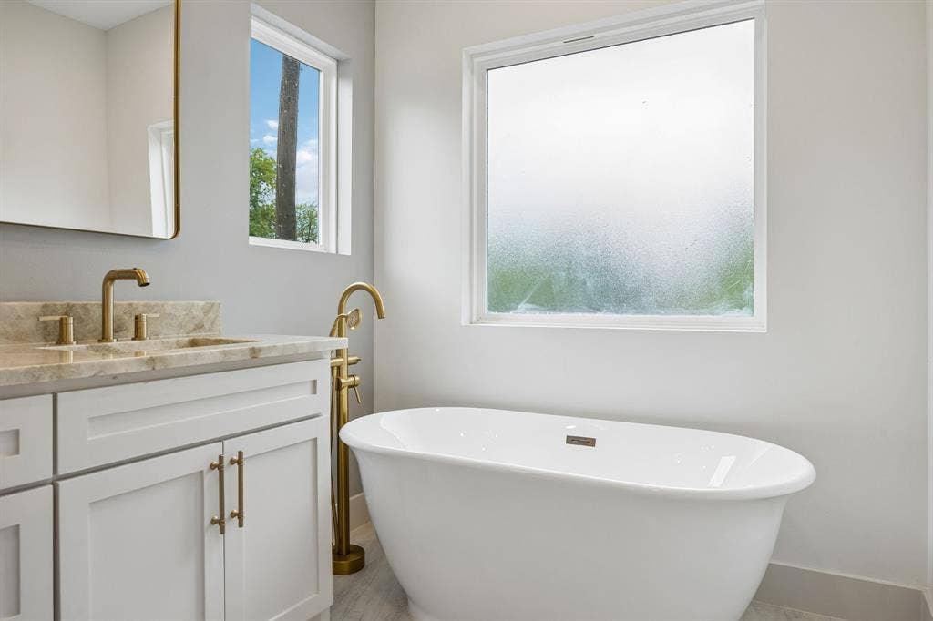 Freestanding soaking tub is just waiting for you to relax in after a stressful day!