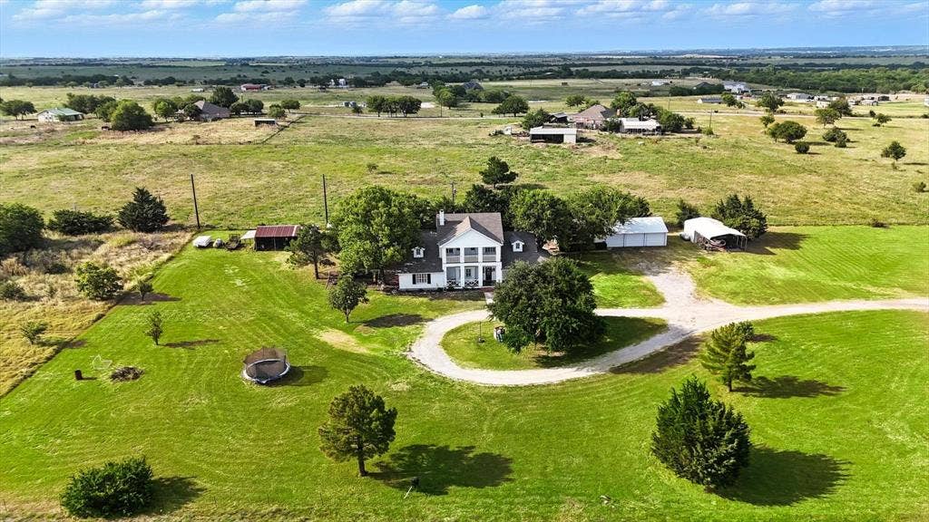 185 Quail Run Court, Decatur, TX 76234 Colonial-style residence featuring a prominent two-story portico