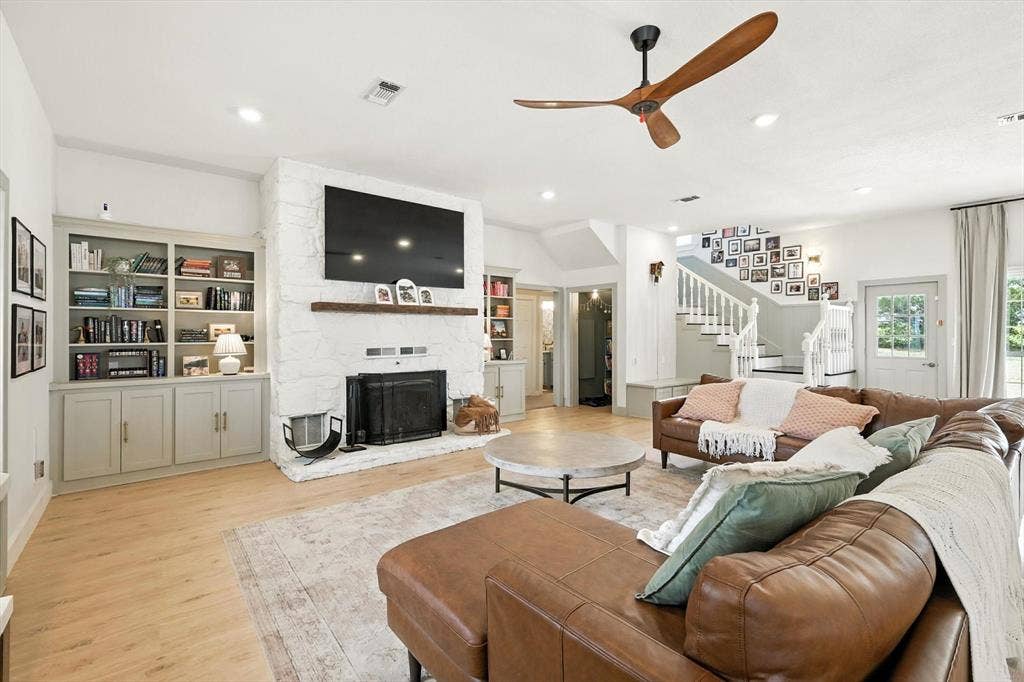 185 Quail Run Court, Decatur, TX 76234 White stone fireplace with a wood mantel