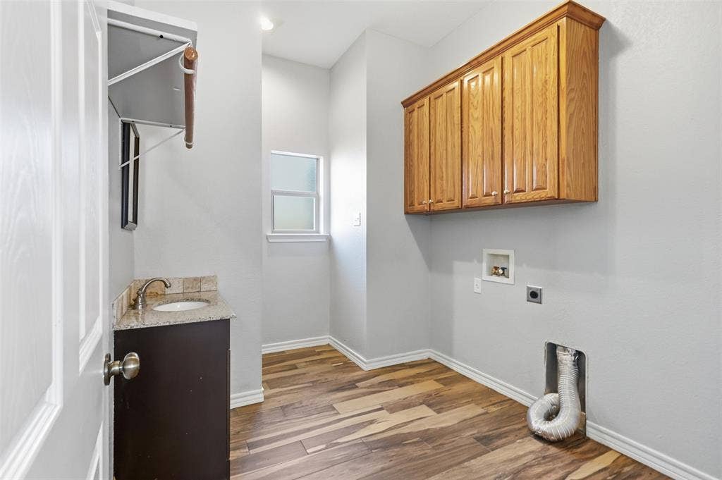 1013 Telford Trail, Crowley, TX 76036 Half bath (toilet and sink) tucked in the laundry space