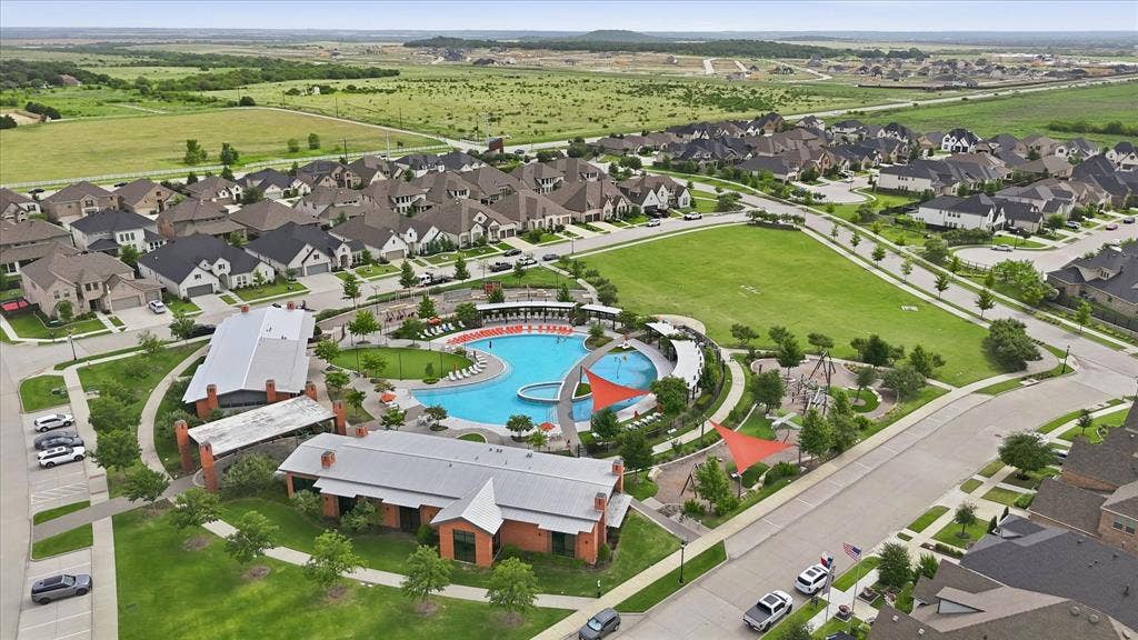 2637 Basswood Drive, Northlake, TX 76226 Expansive community with varied architectural styles, a large swimming pool, and a dedicated park area