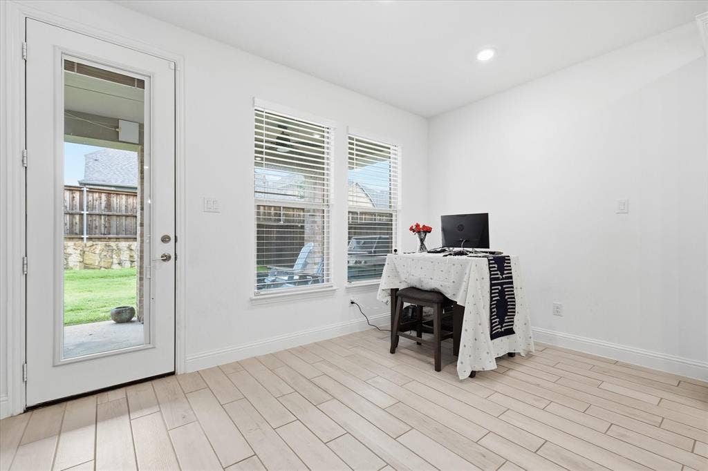 2637 Basswood Drive, Northlake, TX 76226 Light wood-finish flooring, white walls, and a glass-paneled exterior door