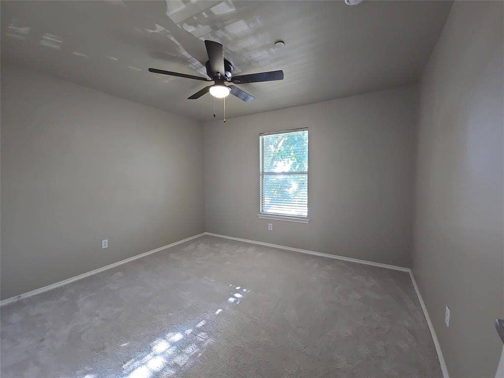 8621 Brunswick Drive, Plano, TX 75024 Recessed window with blinds, ceiling-mounted fan with integrated light, and neutral wall paint