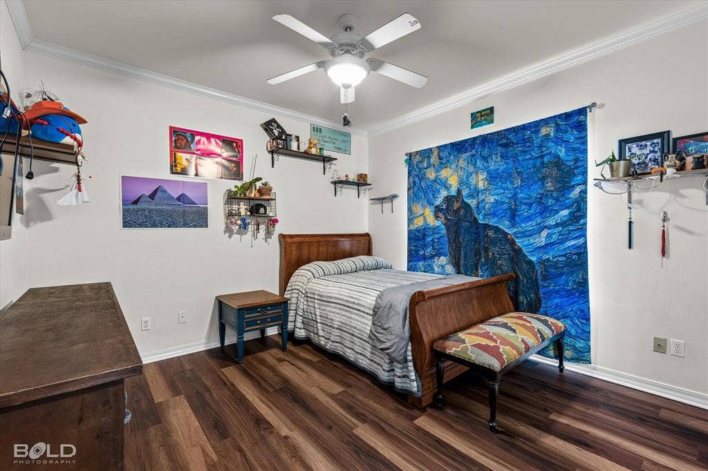 206 Silver Fox Circle, Haughton, LA 71037 Bedroom featuring wood-finish flooring, crown molding, and a ceiling-mounted light fixture with a fan
