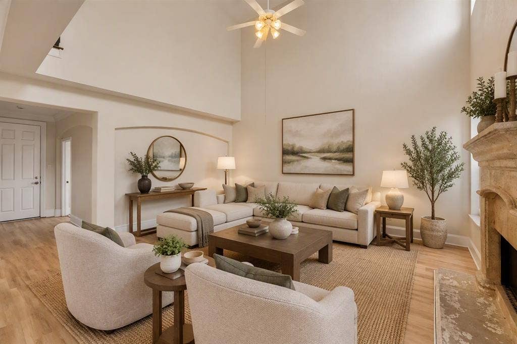 8115 Dogwood Lane, Irving, TX 75063 Vaulted ceilings with a ceiling fan, a stone-finish fireplace, and wood-finish flooring