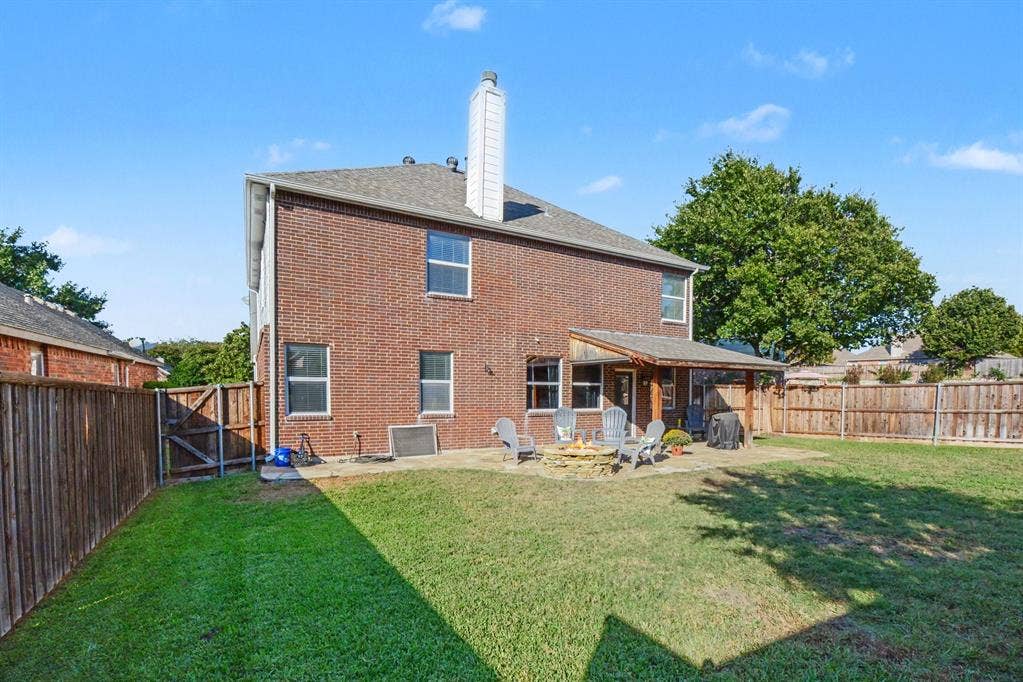 6509 Cartier Court, McKinney, TX 75072 Brick exterior with multiple windows