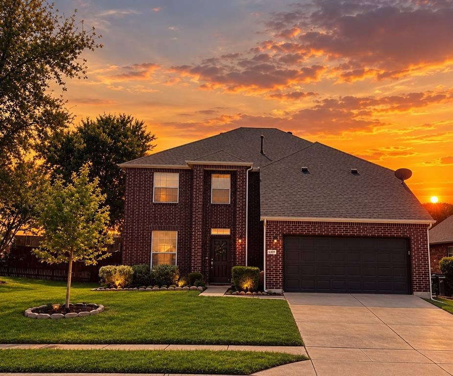 6509 Cartier Court, McKinney, TX 75072 Brick exterior with a dark roof and a two-car garage