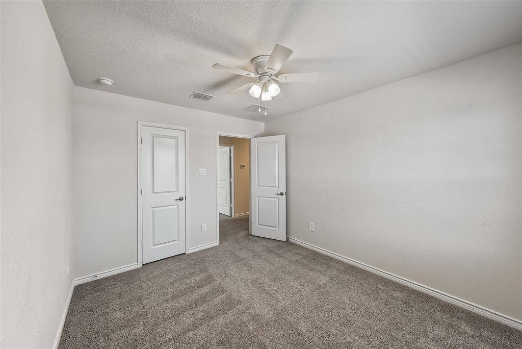 Neutral-toned carpeting throughout