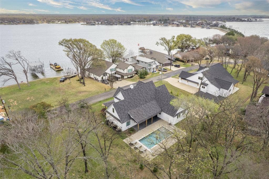653 Enchanted Isles Drive, Mabank, TX 75156 Lake views with a pool.