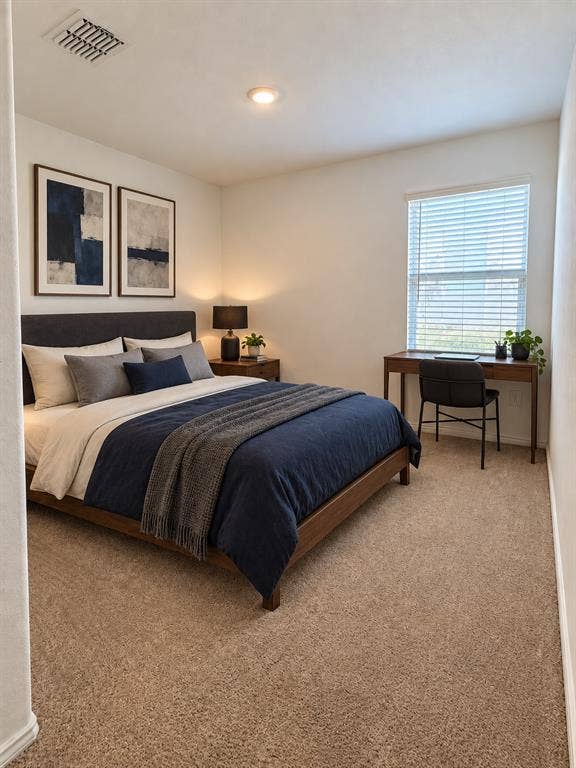 *Virtually Staged* Well-sized secondary bedroom featuring neutral carpeting, recessed lighting, and a  large window for natural light.