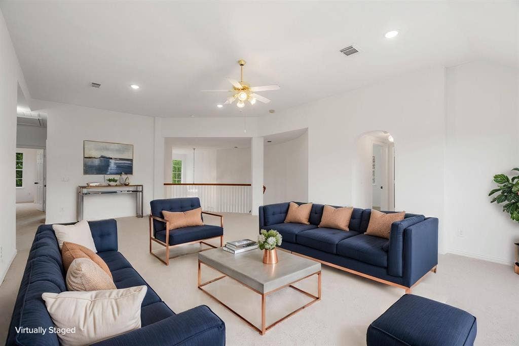 3307 Meadow Wood Drive, Richardson, TX 75082 Vaulted ceiling, ceiling fan, recessed lighting, white walls, and an arched entryway
