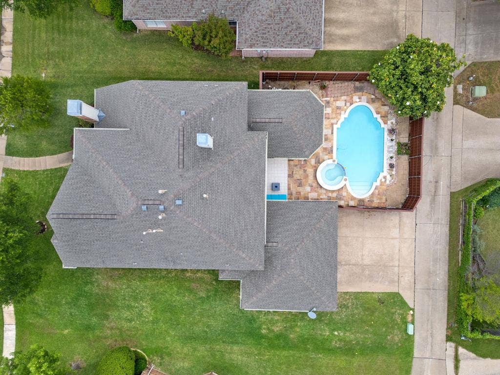 3307 Meadow Wood Drive, Richardson, TX 75082 Shingle roof, swimming pool, spa, stone paver patio, and wood fencing