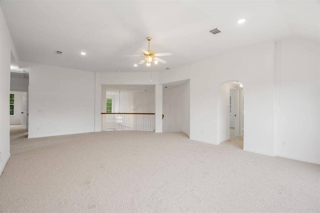 3307 Meadow Wood Drive, Richardson, TX 75082 Expansive room featuring light-toned carpeting, vaulted ceiling, and recessed lighting