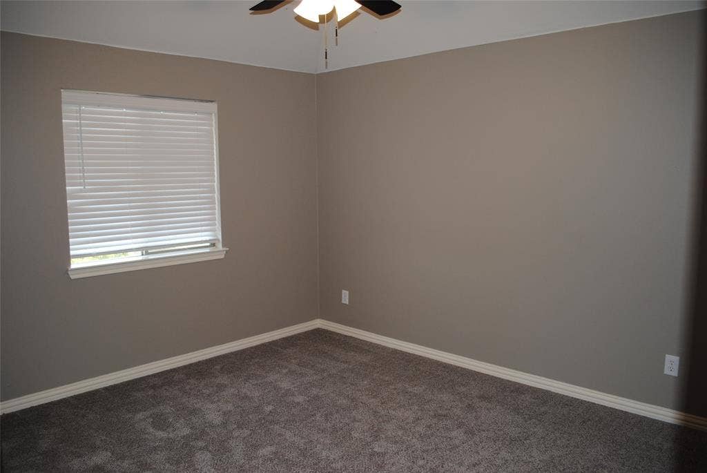 5108 Blackwood Drive, McKinney, TX 75071 Carpeted room featuring a ceiling fan, a window with white blinds, and neutral-toned walls